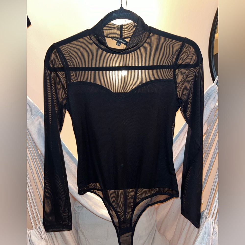 Black, partly sheer long sleeve top